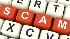 a keyboard highlighting the word SCAM